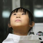 Black Haired Girl on White Shirt