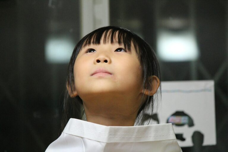 Black Haired Girl on White Shirt