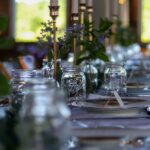 a table with glasses and plates