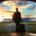 man holding luggage photo, leaving self behind