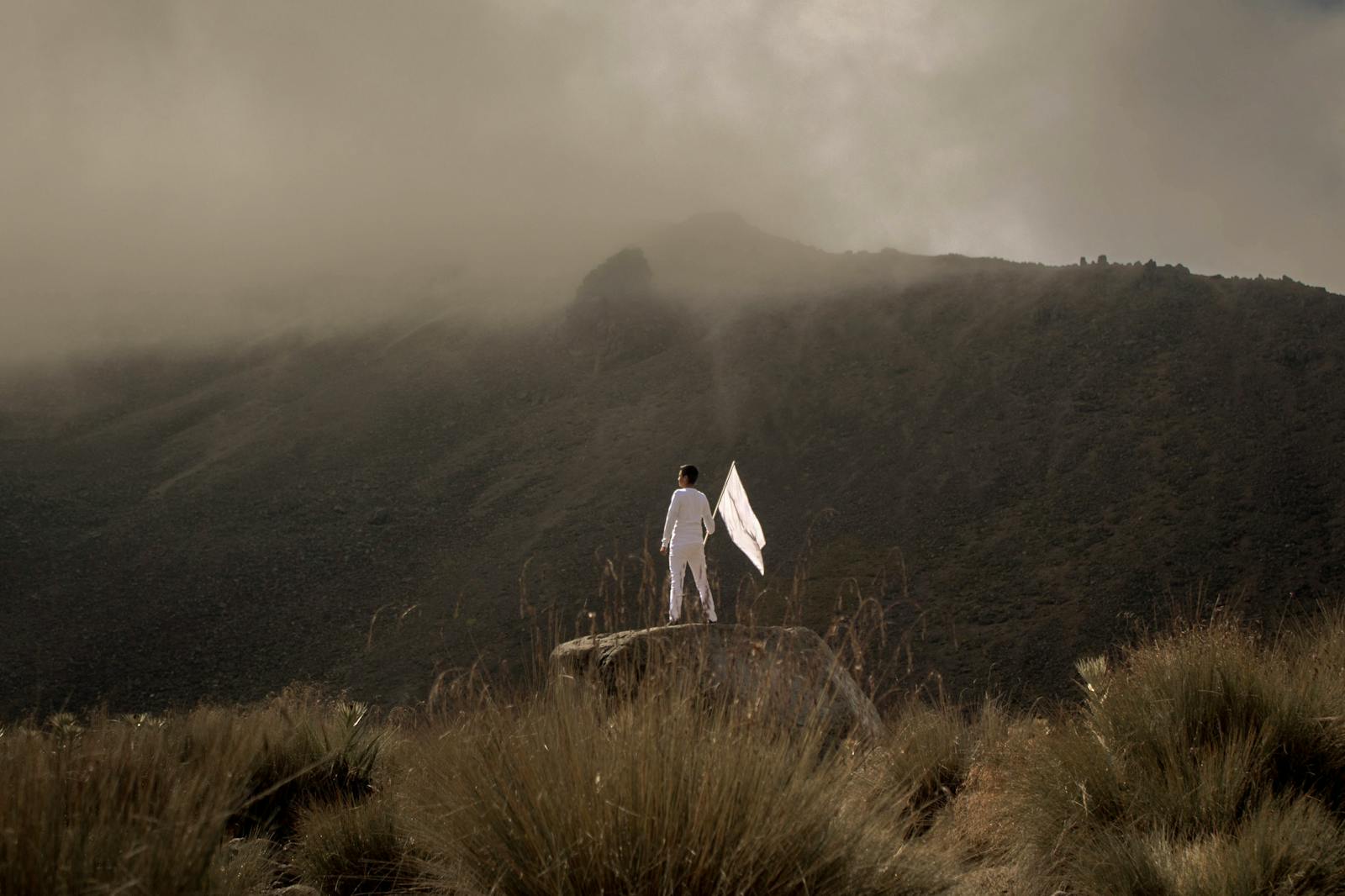 surrender, Person with White Flag Standing on Rock Near Nevado de Toluca in Mexico