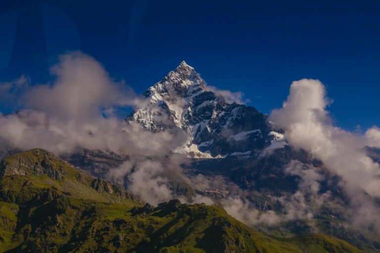 snow covered mountain under blue sky during daytime