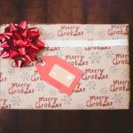 red ribbon on gift box, secret gift