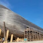 a large wooden boat sitting on top of a beach