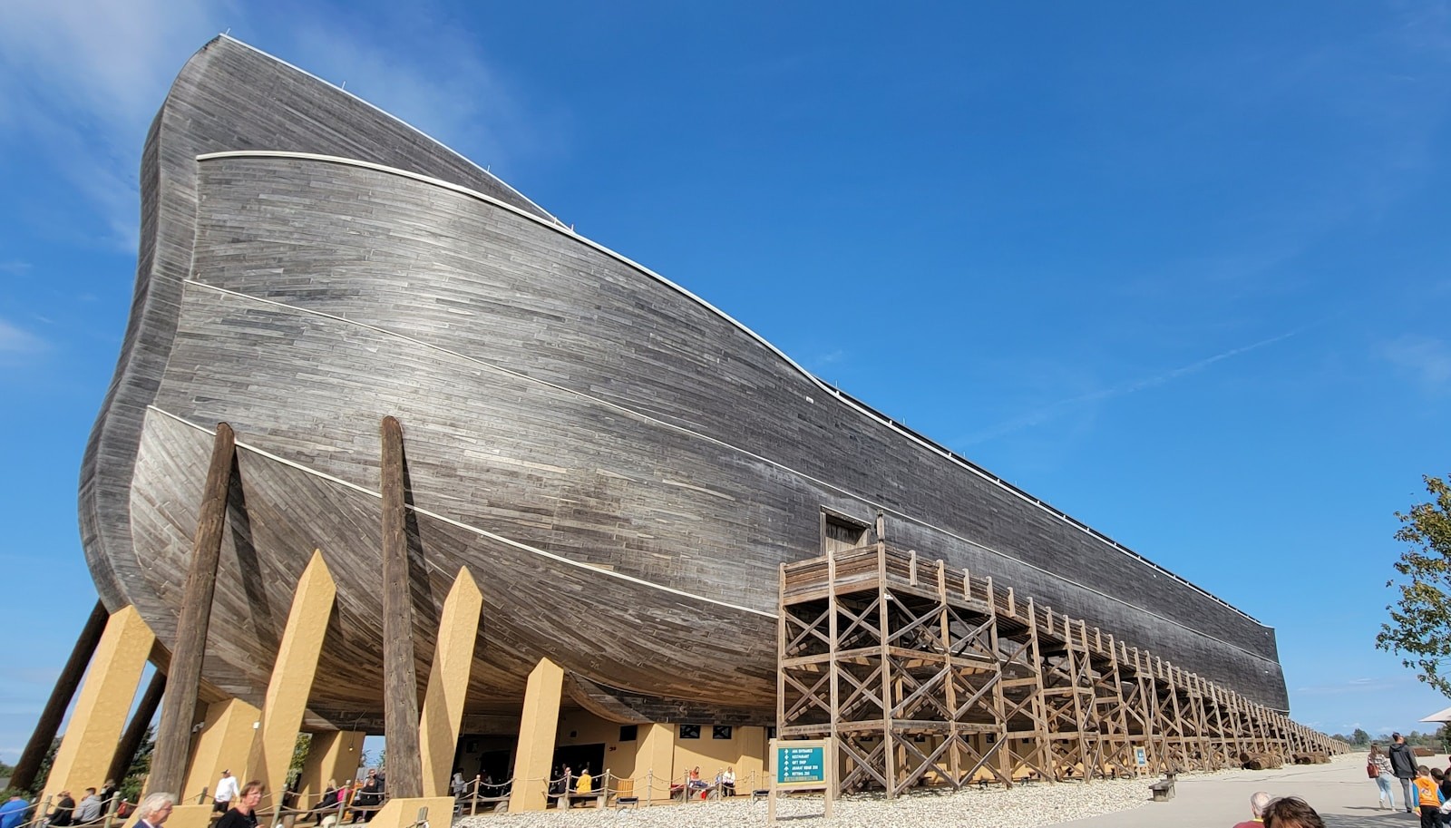 a large wooden boat sitting on top of a beach