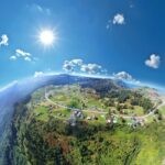 an aerial view of a small town on a hill