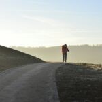 person walking on road during daytime