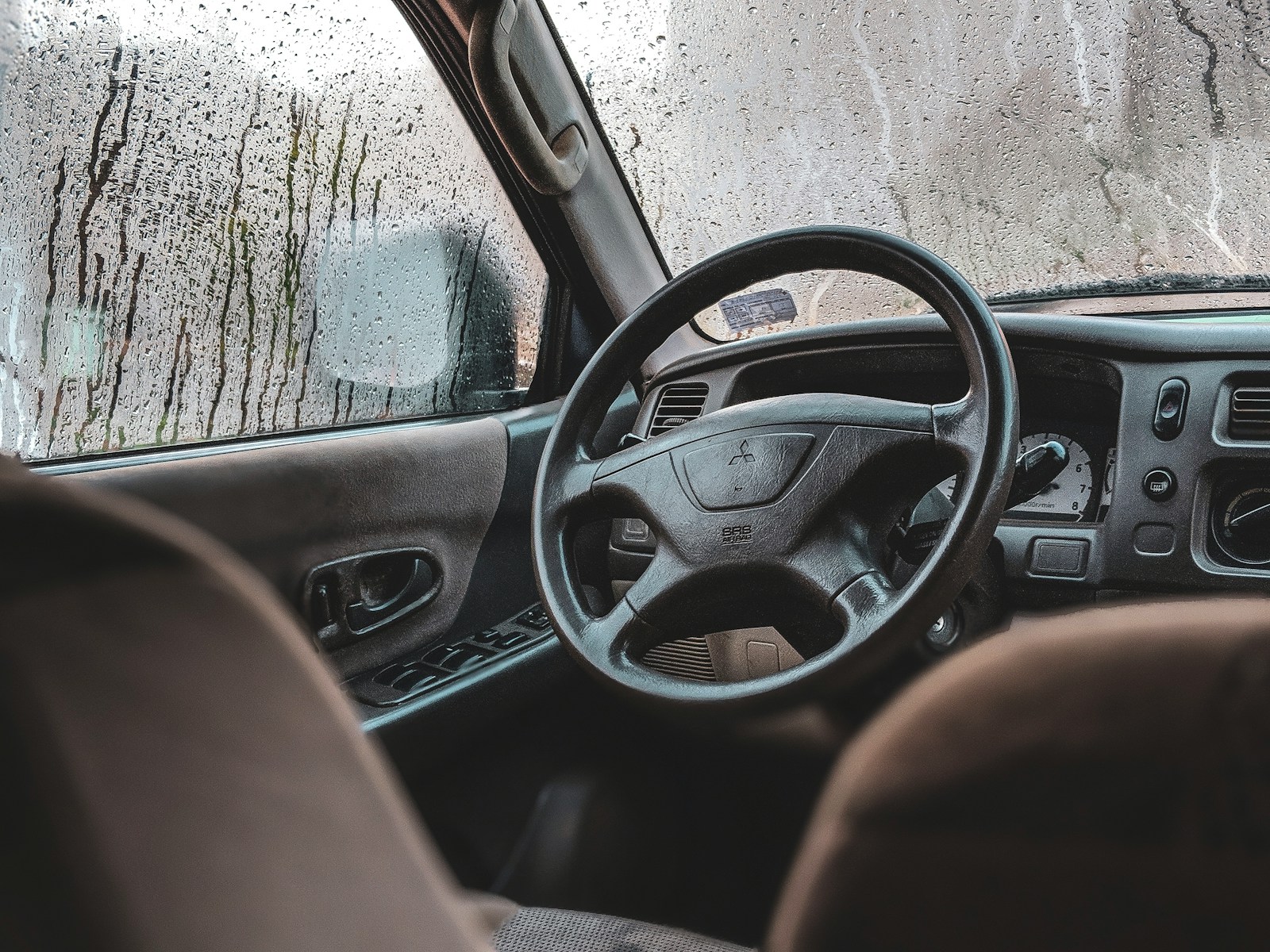 black Mitsubishi vehicle steering wheel, take back control