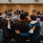 church, group of people standing in front of people